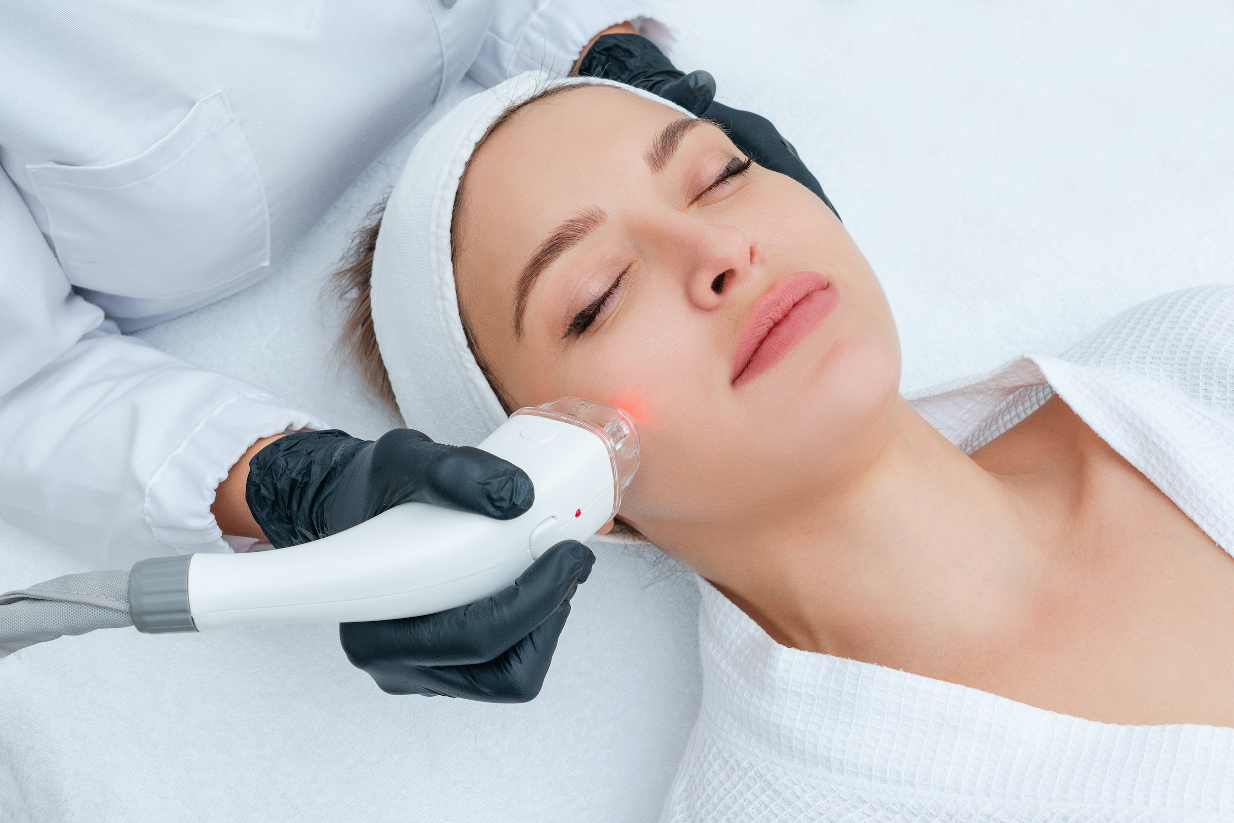 Young woman receiving laser treatment